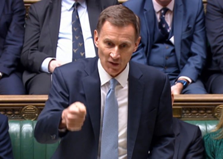 Finance minister Jeremy Hunt told parliament: 'Keeping taxes down matters to Conservatives in a way it never can for Labour'. ©AFP