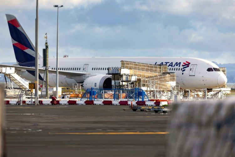 The LATAM Airlines Boeing 787 Dreamliner plane that suddenly lost altitude mid-flight, dropping violently and injuring dozens of travellers, is seen on the tarmac of the Auckland International Airport on March 12, 2024. ©AFP