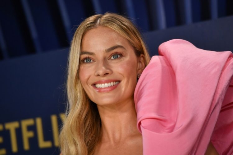 Margot Robbie starred in the $1.4 billion-grossing 'Barbie', which took the box office by storm, but a new report found only a third of top films had a female lead. ©AFP