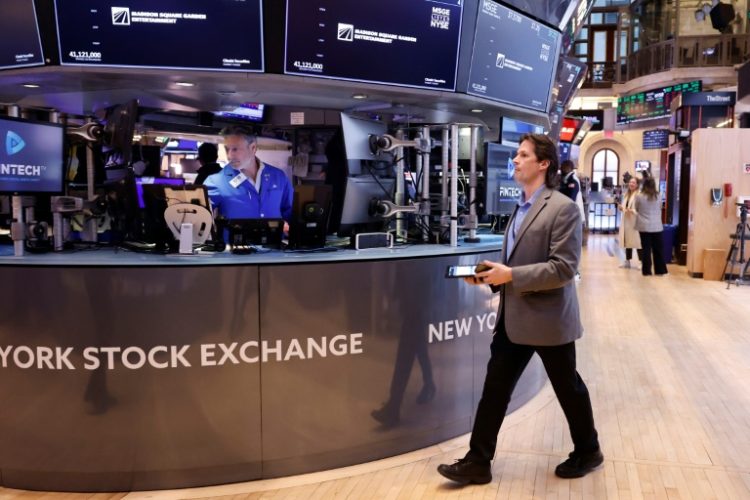 Wall Street rose on AI optimism Thursday after the release of the personal consumption expenditures (PCE) price index offered traders some relief. ©AFP