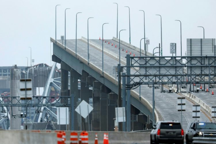 The collapse of the Francis Scott Key Bridge will bring an economic hit but analysts say it is unlikely to make a broad-based impact. ©AFP