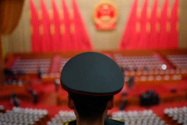 A member of the People's Liberation Army (PLA) band stands before the opening session of the National People's Congress (NPC) at the Great Hall of the People in Beijing on March 5, 2024.. ©AFP