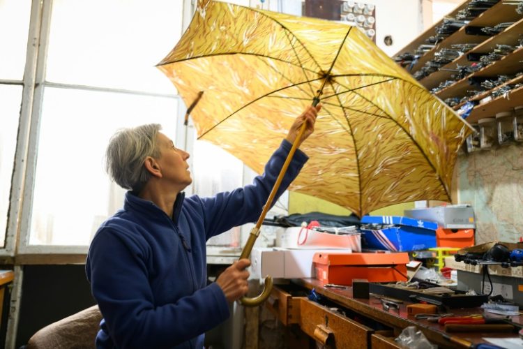 'I believe I can repair 98 percent of all the umbrellas I get,' says Slovenian Marija Lah. ©AFP