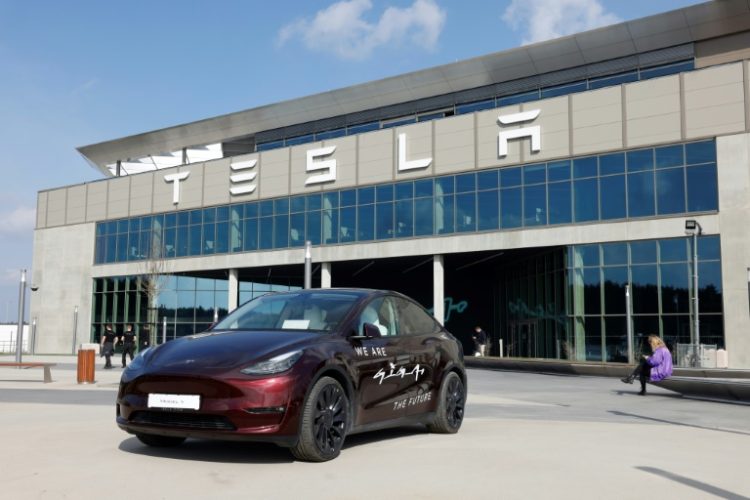 A Tesla car stands in front of the company's electric car plant in Gruenheide near Berlin, Germany, on March 13, 2024. ©AFP