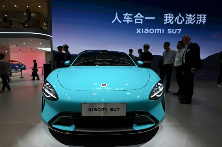 The consumer tech giant is the latest entrant to China's cut-throat EV market, with its new SU7 model the star of the show. ©AFP