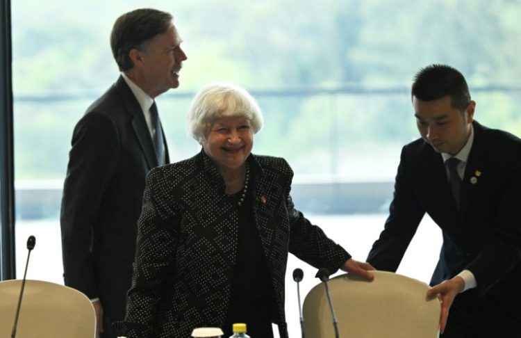 US Treasury chief Janet Yellen (C) and Ambassador to China Nicholas Burns (L) attend a roundtable with business leaders in Guangzhou. ©AFP
