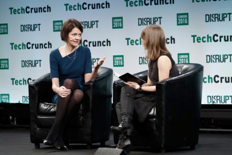 Darktrace chief executive Poppy Gustafsson (L) said the group's 'technology has never been more relevant in a world increasingly threatened by AI-powered cyberattacks'. ©AFP