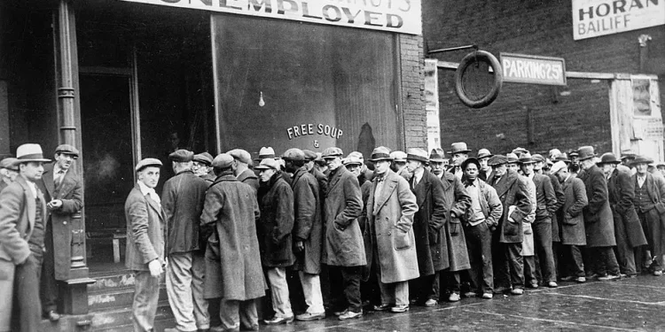 Unemployed men queued outside a depression soup kitchen opened in Chicago, February 1931.