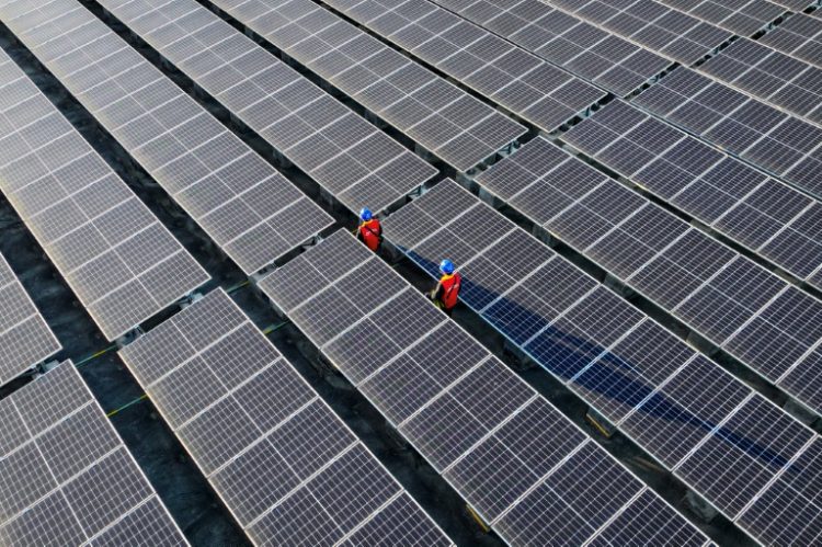 China is a manufacturing powerhouse, and also dominates the production of green tech such as solar panels. ©AFP