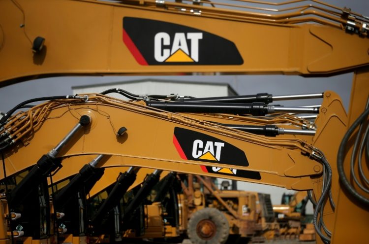 Caterpillar made record payouts to shareholders in the first quarter on the strength of price hikes that boosted profits . ©AFP