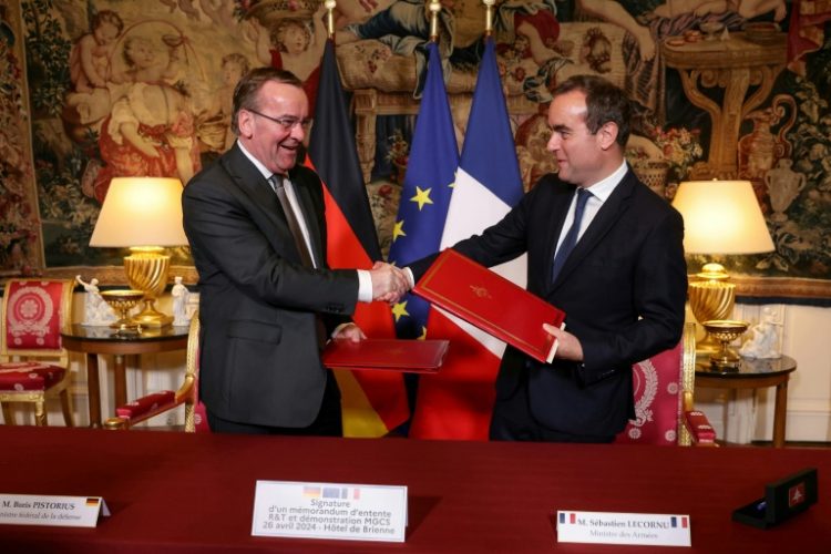 Boris Pistorius, left, and Sebastien Lecornu after signing an agreement on the MGCS 'tank of the future' project in Paris    . ©AFP