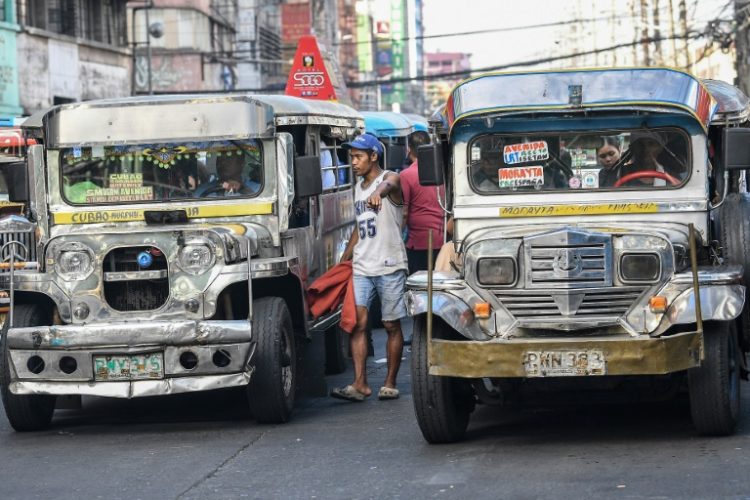 While jeepneys now vie with buses, vans and motorbikes for passengers, they are still a common sight and sound in the archipelago nation. ©AFP