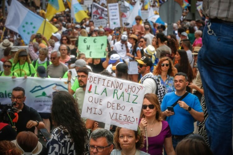 Tens of thousands of demonstrators marched across Spain's Canary Islands in April to demand changes to the model of mass tourism, which they say is overwhelming the Atlantic archipelago. ©AFP