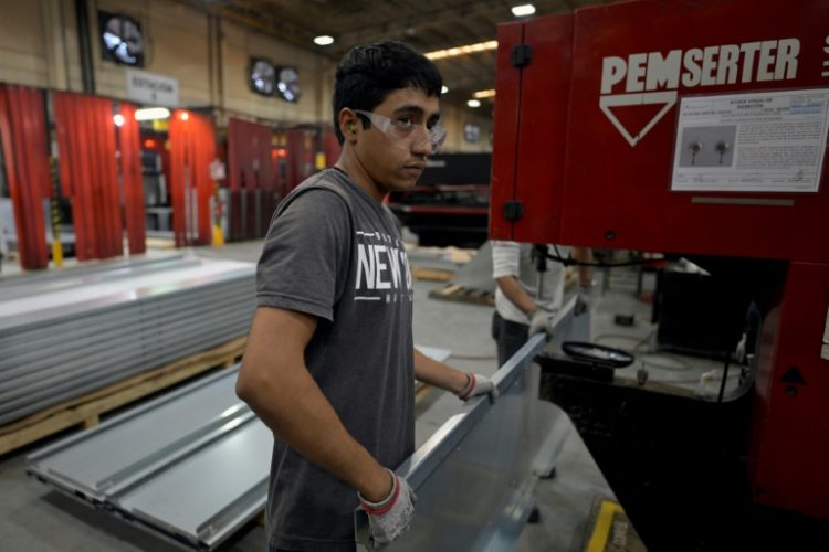 A worker at an Aztek Technologies metal parts plant on the outskirts of the Mexican industrial hub of Monterrey. ©AFP