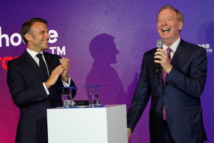 French President Emmanuel Macron with Microsoft CEO Brad Smith, whose company announced four billion euros in investment in France. ©AFP