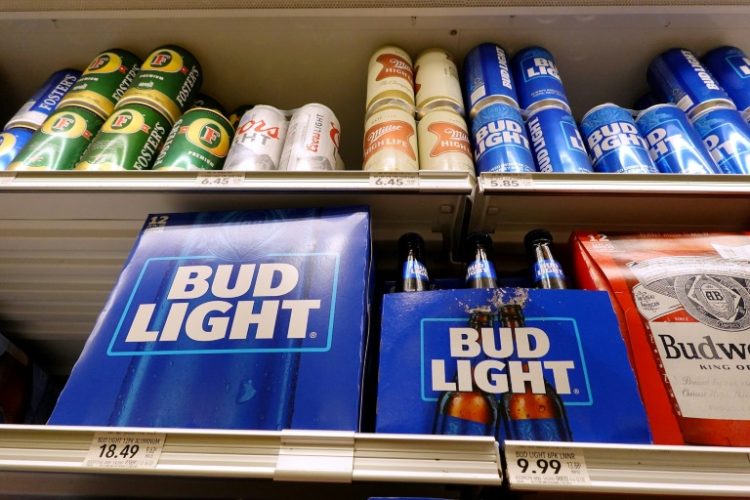 AB InBev got caught in the US culture wars in 2023 after it teamed up with a transgender influencer to promote Bud Light, which sparked a boycott by conservative figures.. ©AFP