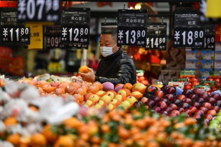 Data showing Chinese consumer prices rising more than expected last month provided some fresh optimism over the world's number two economy. ©AFP