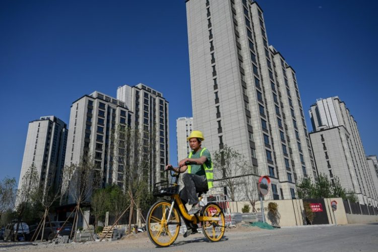 China's economic growth has been battered in recent years by a long-running debt crisis in the property market. ©AFP