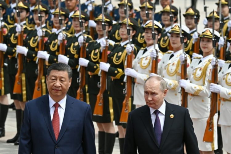 Leaders Xi Jinping and Vladimir Putin framed their nations' ties as a stabilising force in a chaotic world as they met Thursday in Beijing. ©AFP