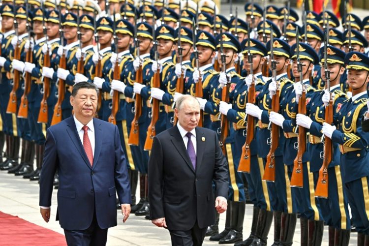 Leaders Xi Jinping and Vladimir Putin framed their nations' ties as a stabilising force in a chaotic world as they met Thursday in Beijing. ©AFP