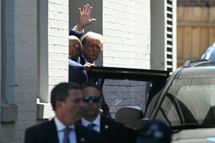 Former US president Donald Trump waves as he departs the Capitol Hill Club following a meeting with US House Republicans on Capitol Hill in Washington, DC, on June 13, 2024. ©AFP