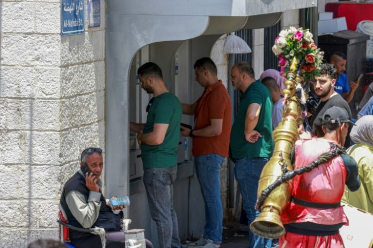 Banking in the Palestinian territories is challenging, with the Palestinian Authority under scrutiny for potential terror financing, hindering transactions. ©AFP