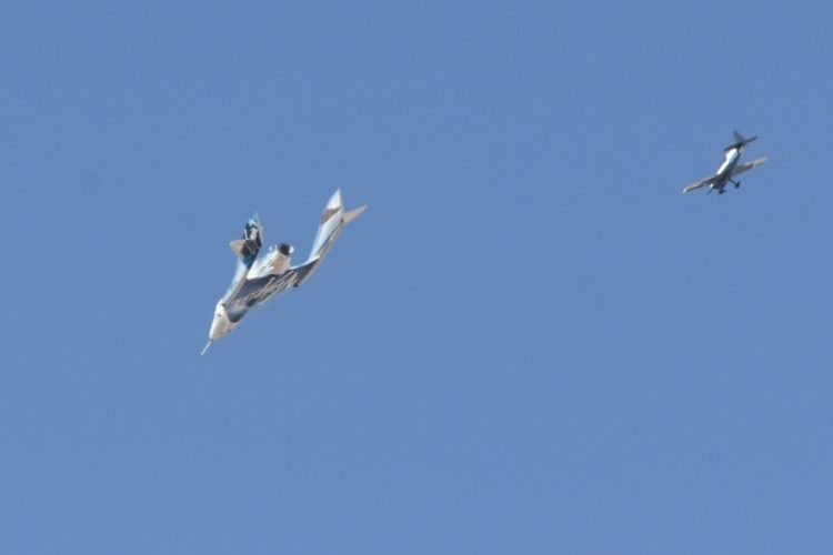 The Virgin Galactic SpaceShipTwo spaceplane Unity and mothership separate as they fly way above Spaceport America in New Mexico in July 2021 on the way to the cosmos. ©AFP