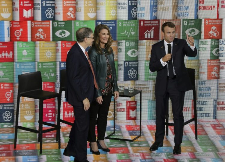 Melinda French Gates, pictured in 2018 with Bill Gates (left) and French President Emmanuel Macron, has pledged to use her fortune to help women and families . ©AFP