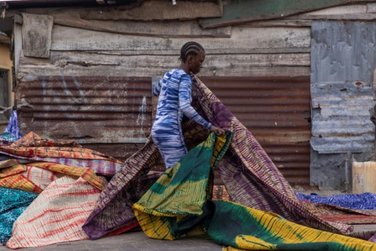 Adire is a popular tie-dye fabric typically used for traditional outfits worn on special occasions in Nigeria . ©AFP