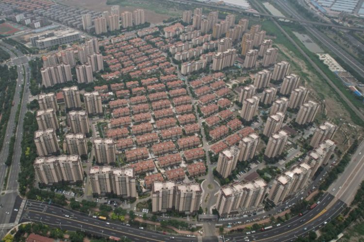 China's property crisis has seen house prices plunge and millions of homes left empty or unfinished. ©AFP