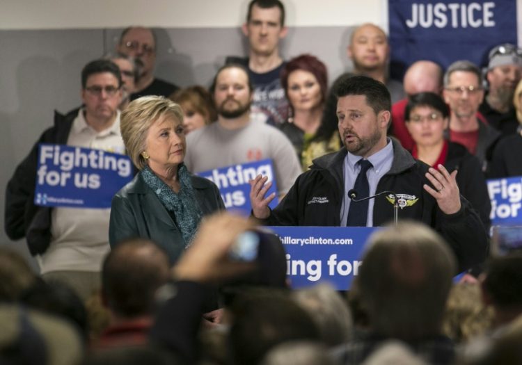 Jon Holden -- seen here with Hillary Clinton in March 2016 -- is president of the International Association of Machinists and Aerospace Workers for District 751, which represents some 30,000 Boeing workers. ©AFP