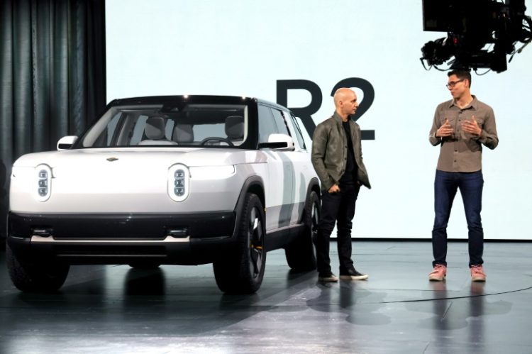 Electric vehicle maker Rivian and Volkswagen announced a joint venture in which the German company will invest $5 billion in the American automaker. ©AFP