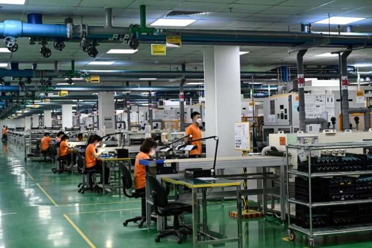 Vietnam, a global manufacturing hub, is targeting growth of between six and 6.5 percent this year. ©AFP