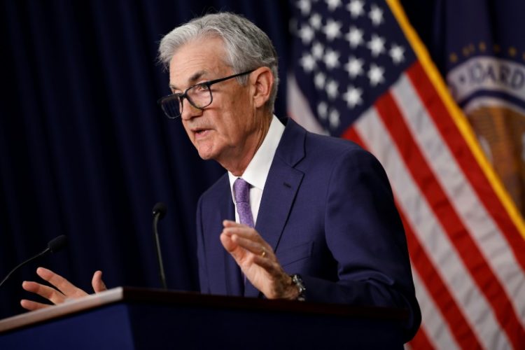 Major US indices scored fresh records following commmentray by Federal Reserve Chair Jerome Powell. ©AFP