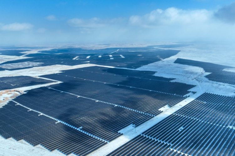 Solar panels in the Gobi desert in north China. China has twice as much wind and solar energy capacity under construction as the rest of the world combined. ©AFP