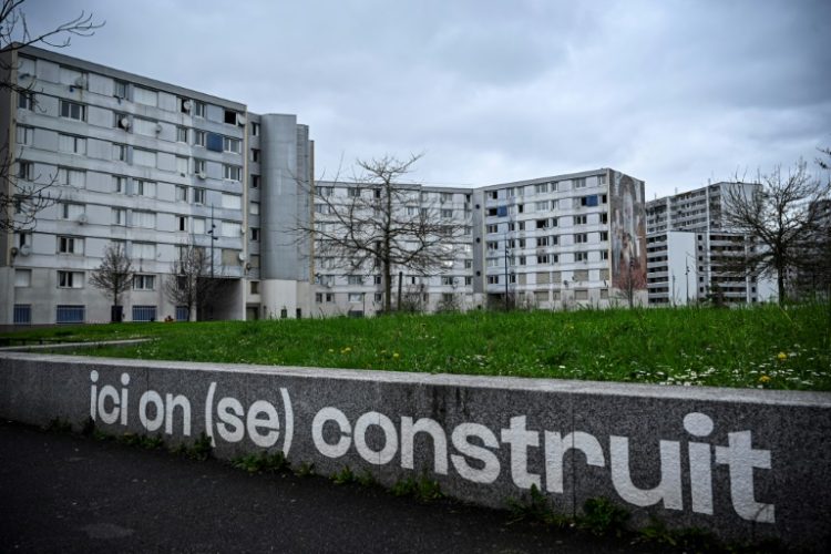 The Francs-Moisins estate near the Stade de France where a sign says: 'Here we build (ourselves)'. ©AFP