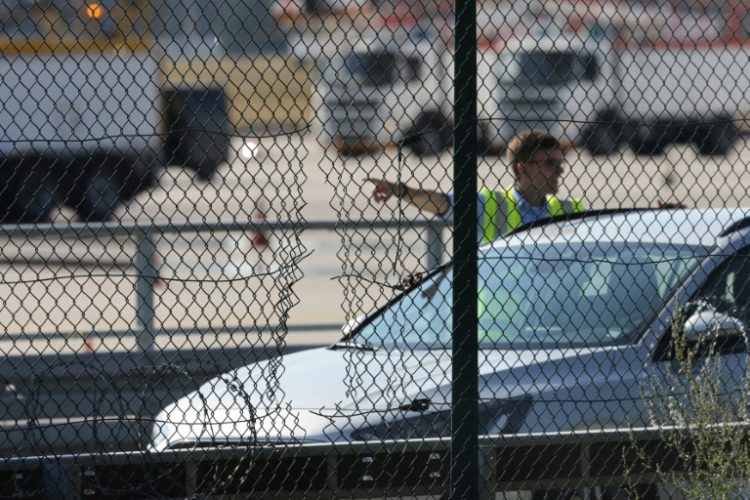 Climate protesters cut their way onto the tarmac at Germany's busiest airport in Frankfurt. ©AFP