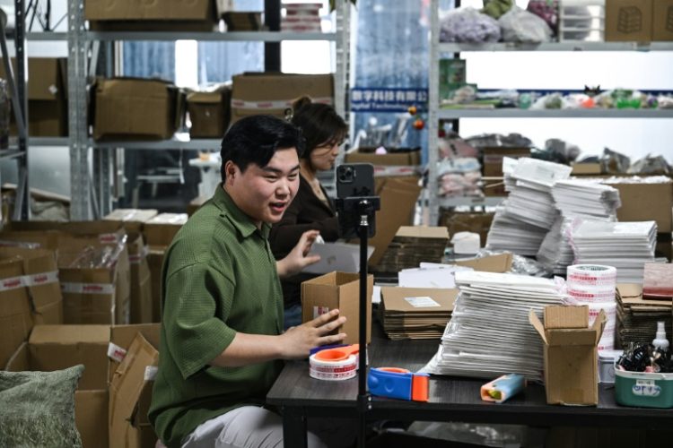 Put off by low pay in his hometown, Ouyang now works as a livestreamer at an e-commerce company in east China's Zhejiang province. ©AFP