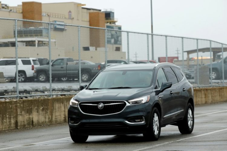 General Motors reported higher profits behind strong  North American sales of the GMC Sierra and other conventional internal combustion engine trucks . ©AFP