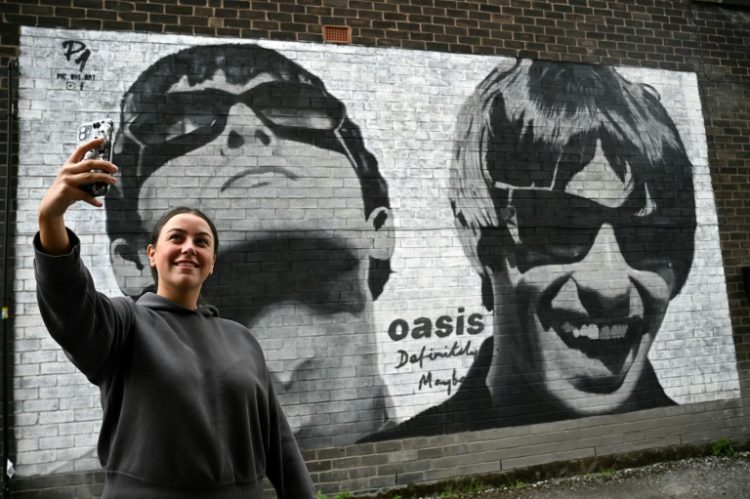 The tour announcement delighted fans who had despaired of ever seeing brothers Liam and Noel Gallagher perform together again. ©AFP