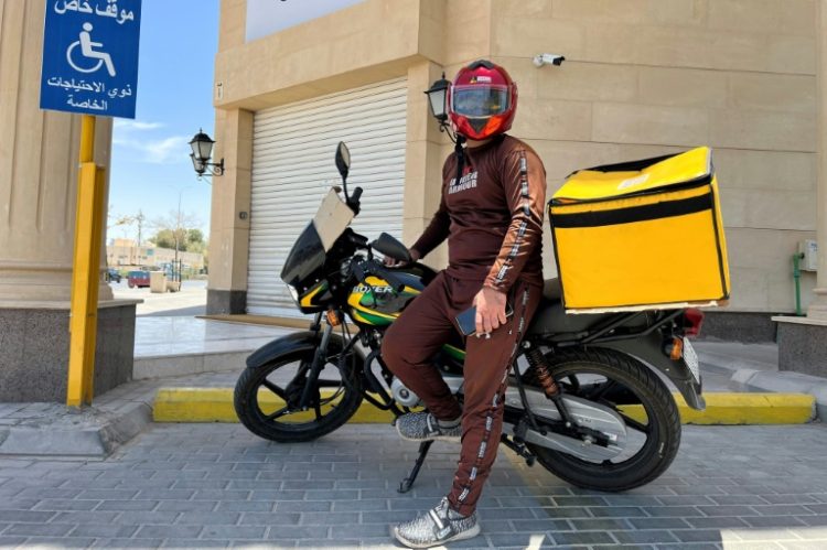 A Pakistani delivery worker poses for a photo during a break in the Saudi capital Riyadh . ©AFP