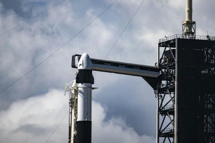 Riding atop a Falcon 9 rocket, the SpaceX Dragon capsule is set to reach a peak altitude of 870 miles (1,400 kilometers) -- higher than any crewed mission in over half a century, since the Apollo era. ©AFP