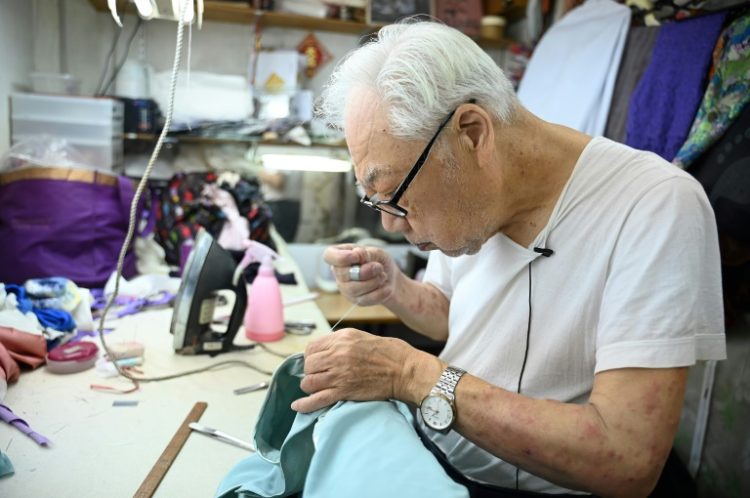 At 88, Yan Kar-man is one of Hong Kong's oldest master tailors of the cheongsam, an elegant, high-collared Chinese dress recognisable for its form-fitting silhouette. ©AFP