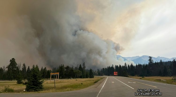 In this July 2024 image, smoke rises from a wildfire burning in Jasper National Park in Canada. The wildfire devoured up to half of the main town. ©AFP