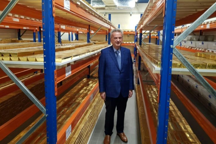 Riad Salameh beside stacks of gold bars in the central bank vaults in Beirut. ©AFP