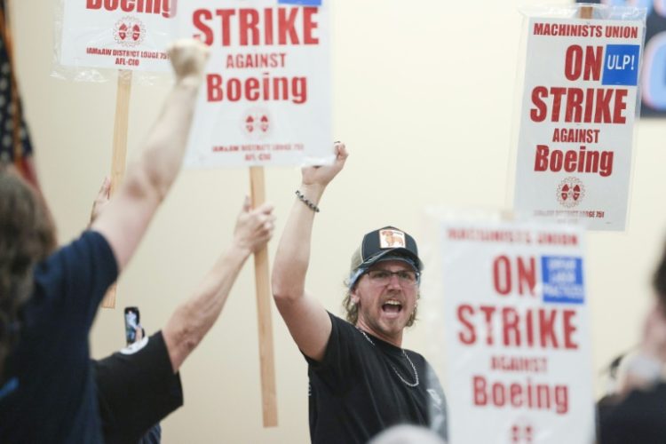 Boeing workers in the Seattle region overwhelmingly voted to strike and reject a contract . ©AFP