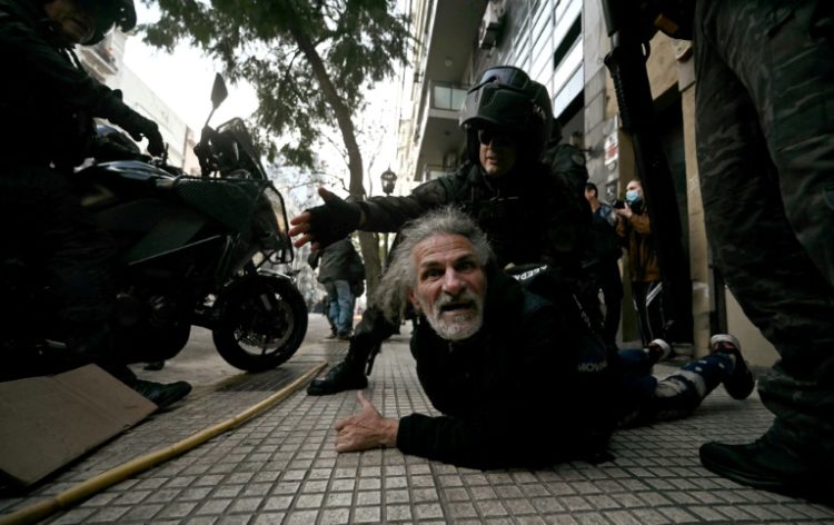 An elderly man is detained by riot police during a protest outside the National Congress in Buenos Aires on September 11, 2024. ©AFP