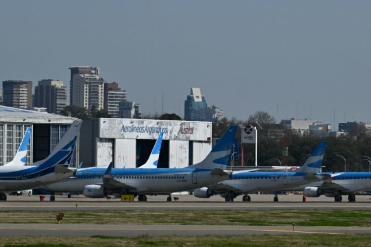 Aerolineas Argentinas airplanes are pictured on the tarmac . ©AFP