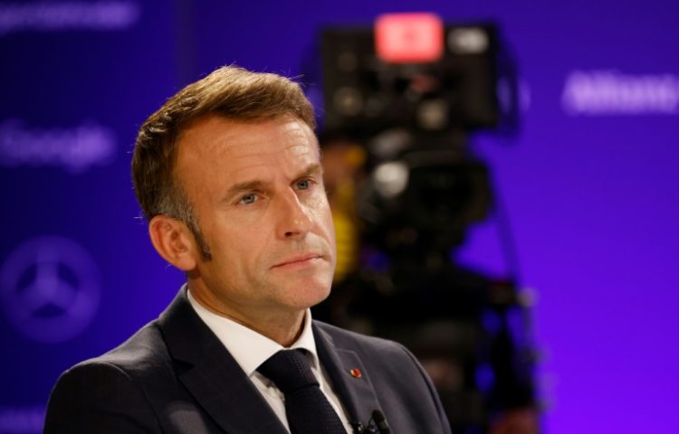 French President Emmanuel Macron said that Chinese subsidies for electric vehicles introduced a 'bias' into the market. ©AFP