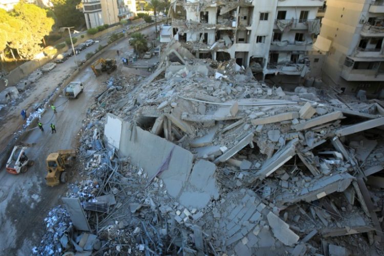 A destroyed building at the site of an Israeli air strike that targeted a branch of the Hezbollah-linked Al-Qard Al-Hassan financial firm in south Beirut . ©AFP